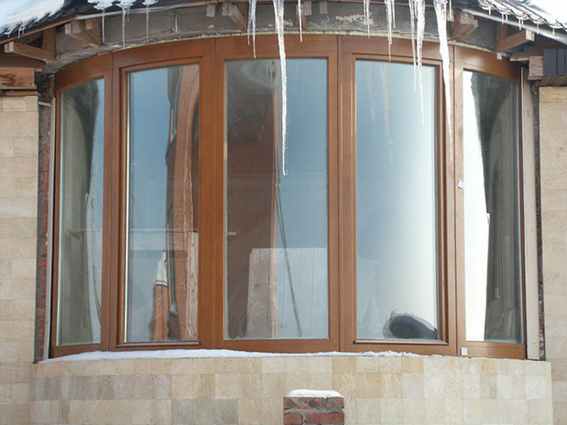 Радиусные деревянные окна для остекления балконов