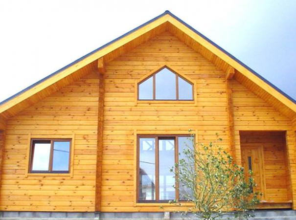 log house with windows made ​​of wood and the input group